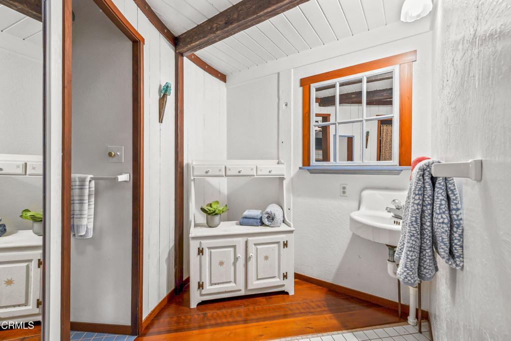 32450 Simpson Lane Fort Bragg, CA 95437 - Photo 36 of 54 a bathroom with a sink a mirror and shower