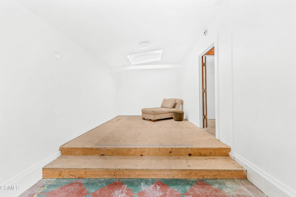 32450 Simpson Lane Fort Bragg, CA 95437 - Photo 42 of 54 a bedroom with a bed and a lamp with potted plant