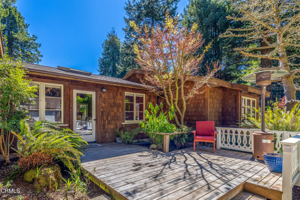32450 Simpson Lane Fort Bragg, CA 95437 - Photo 48 of 54 a view of a house with chairs and table in a patio