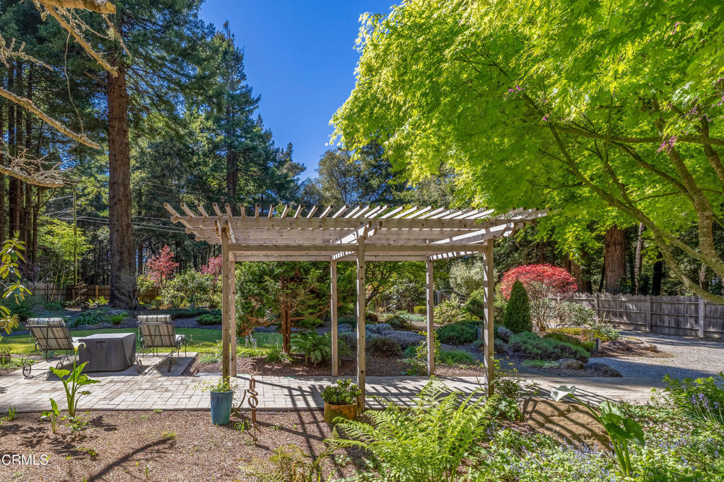 32450 Simpson Lane Fort Bragg, CA 95437 - Photo 51 of 54 a view of a patio with table and chairs under an umbrella