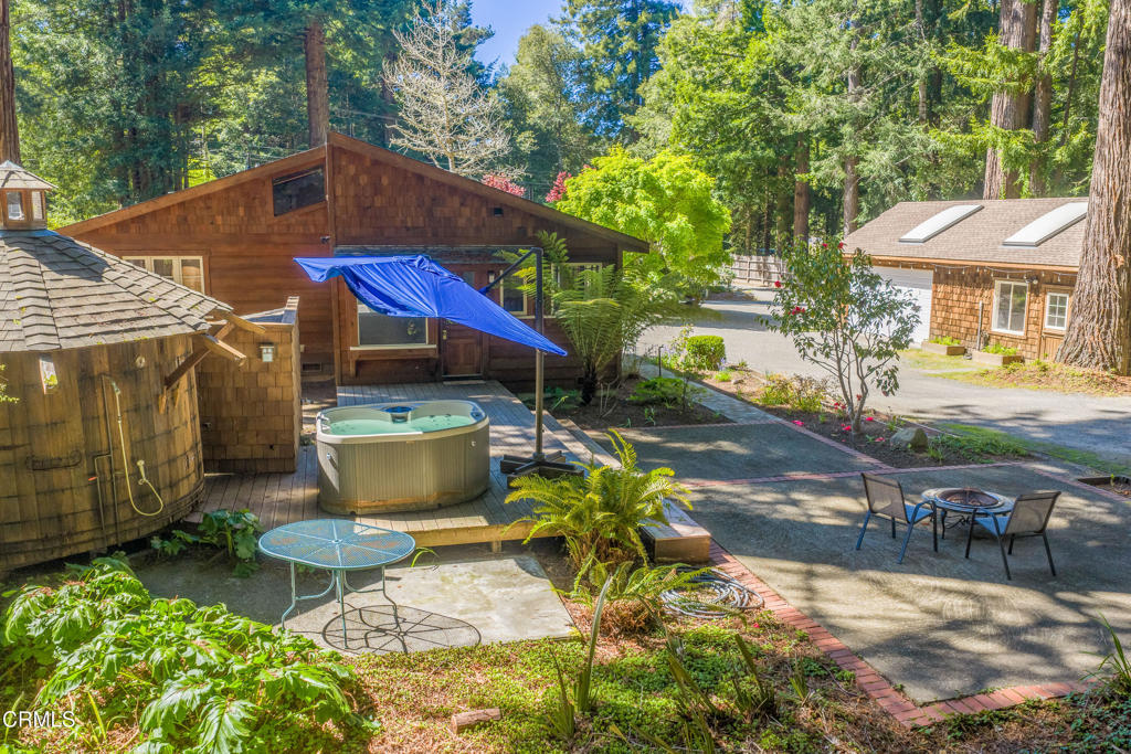 32450 Simpson Lane Fort Bragg, CA 95437 - Photo 6 of 54 a view of a chairs and table in backyard