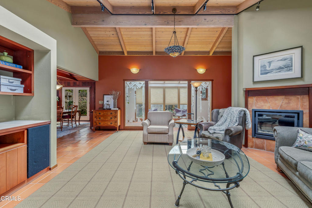 32450 Simpson Lane Fort Bragg, CA 95437 - Photo 8 of 54 a living room with furniture a fireplace and a large window