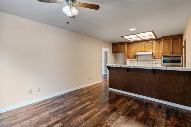 a view of kitchen with window and wooden floor