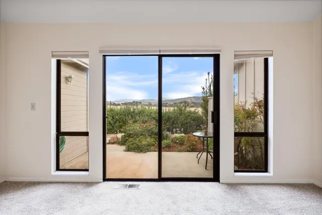 a view of a room that has a large window