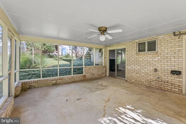 a view of a room with a large window