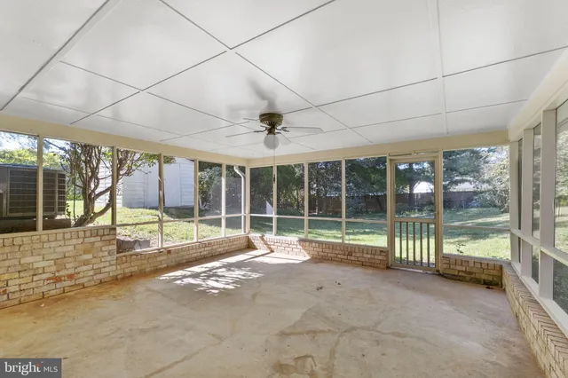a view of a room with wooden floor and roof