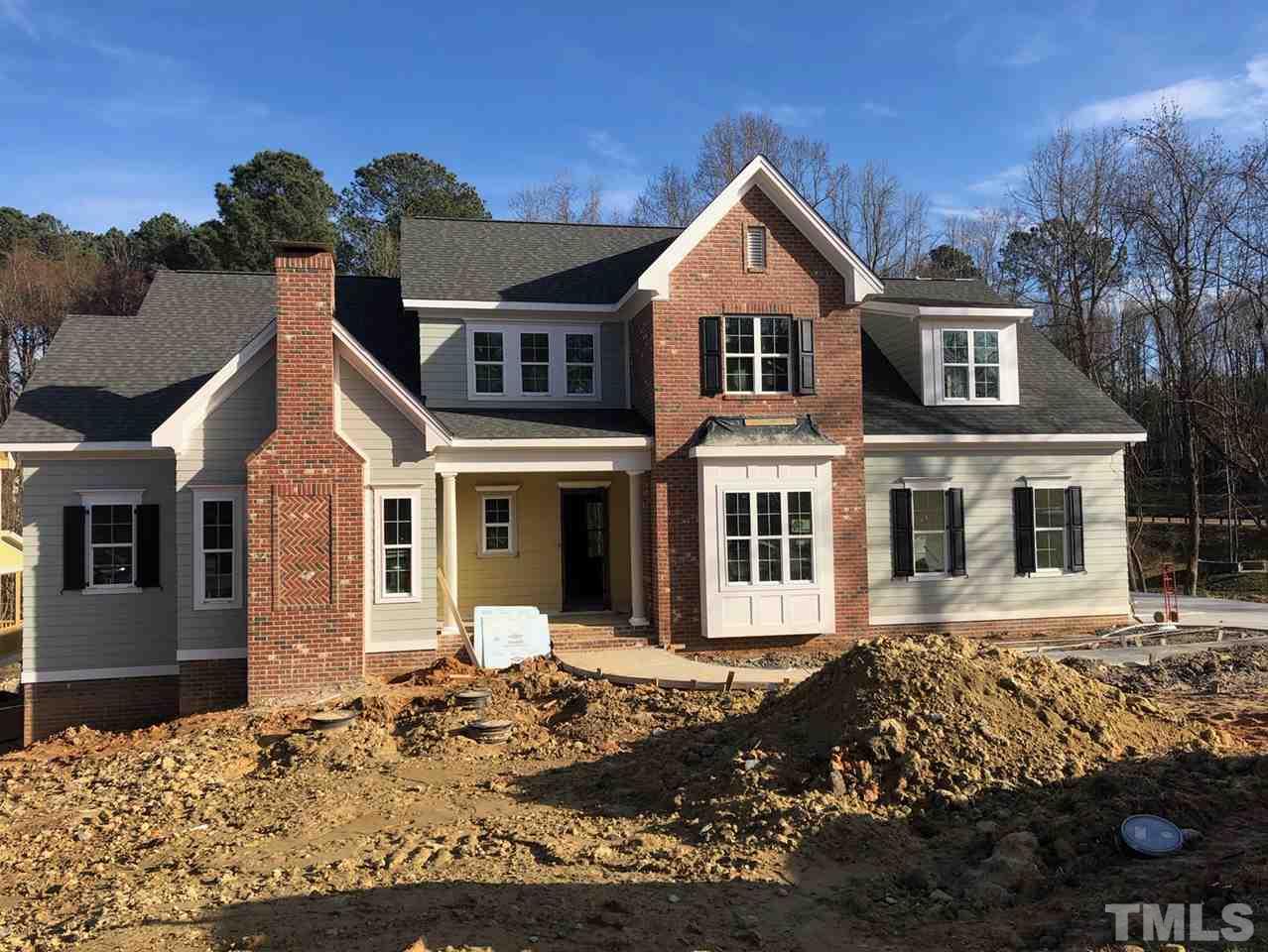 6920 Ray Family Farm Court, Unit LT20 Raleigh, NC 27613 - Photo 1 of 22 a front view of a house with a yard