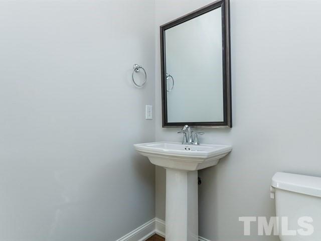 6920 Ray Family Farm Court, Unit LT20 Raleigh, NC 27613 - Photo 3 of 22 a bathroom with a sink and mirror