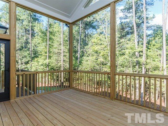 6920 Ray Family Farm Court, Unit LT20 Raleigh, NC 27613 - Photo 21 of 22 a view of a wooden balcony with outdoor space