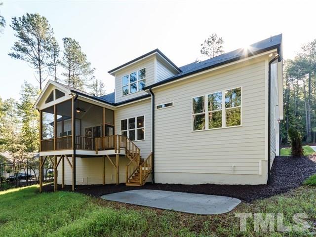 6920 Ray Family Farm Court, Unit LT20 Raleigh, NC 27613 - Photo 22 of 22 a view of a house with a yard