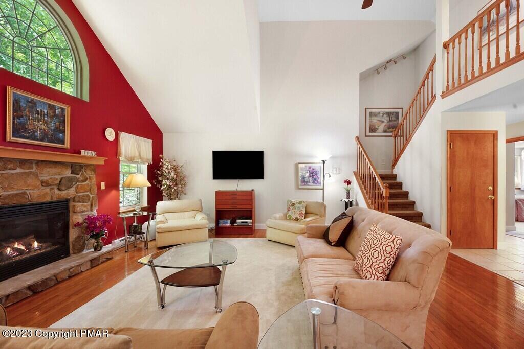 105 Alford Court Bushkill, PA 18324 - Photo 11 of 64 a living room with furniture a flat screen tv and a fireplace