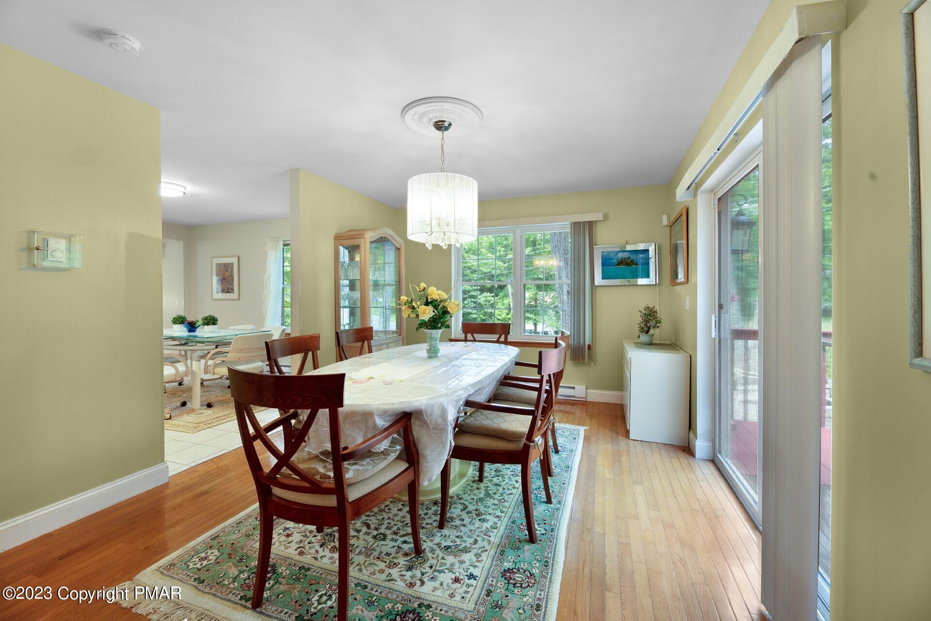 105 Alford Court Bushkill, PA 18324 - Photo 13 of 64 a view of a dining room with furniture and wooden floor