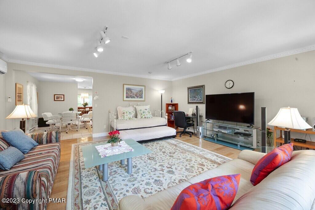 105 Alford Court Bushkill, PA 18324 - Photo 15 of 64 a living room with furniture and a flat screen tv