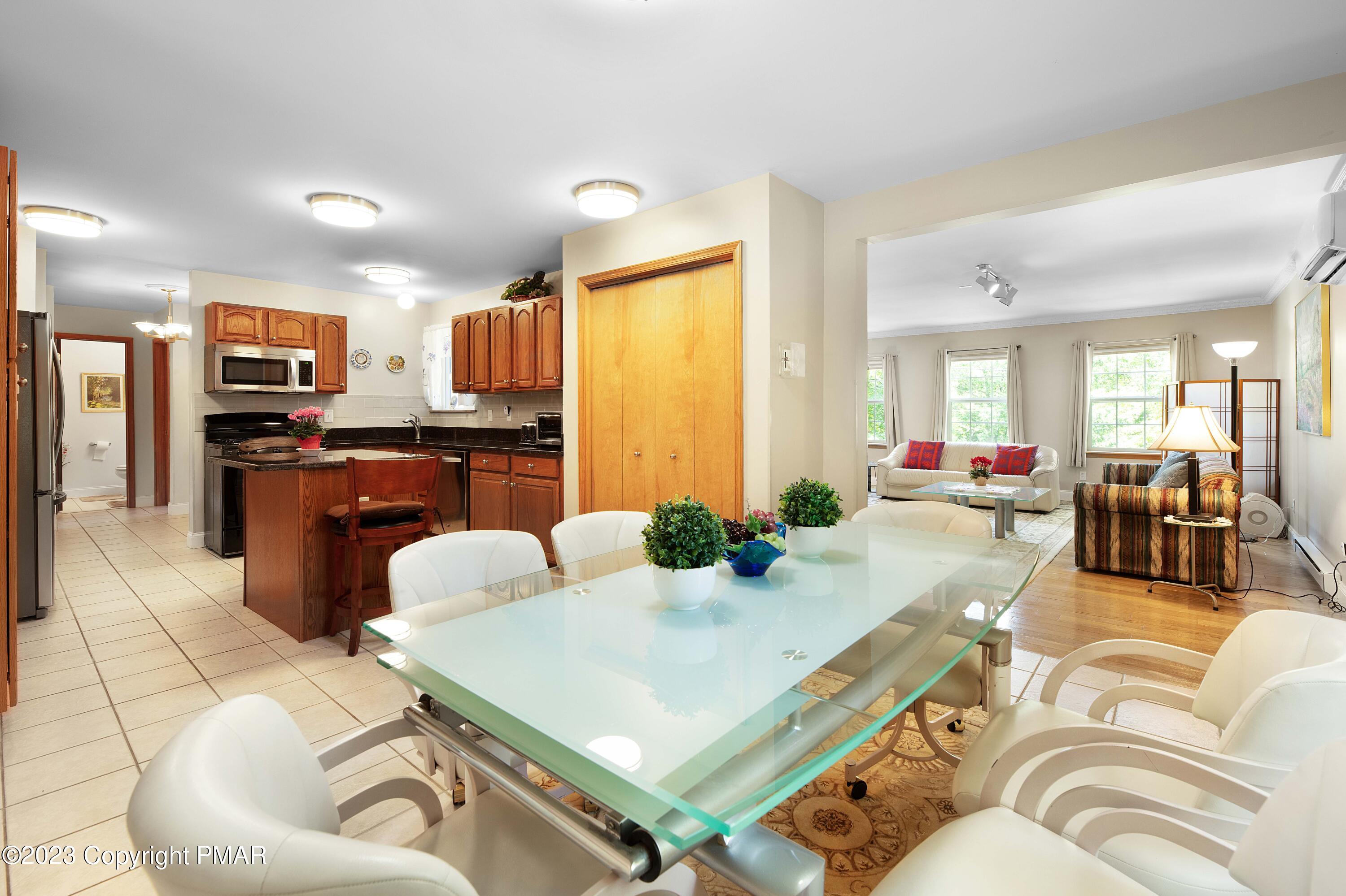 105 Alford Court Bushkill, PA 18324 - Photo 17 of 64 a living room with stainless steel appliances furniture and a view of kitchen