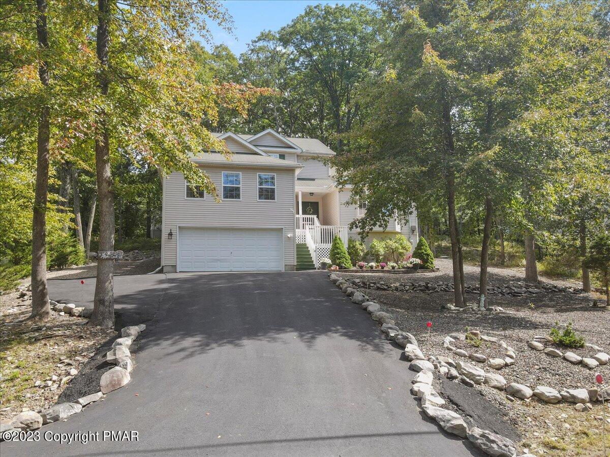 105 Alford Court Bushkill, PA 18324 - Photo 2 of 64 a front view of a house with a yard