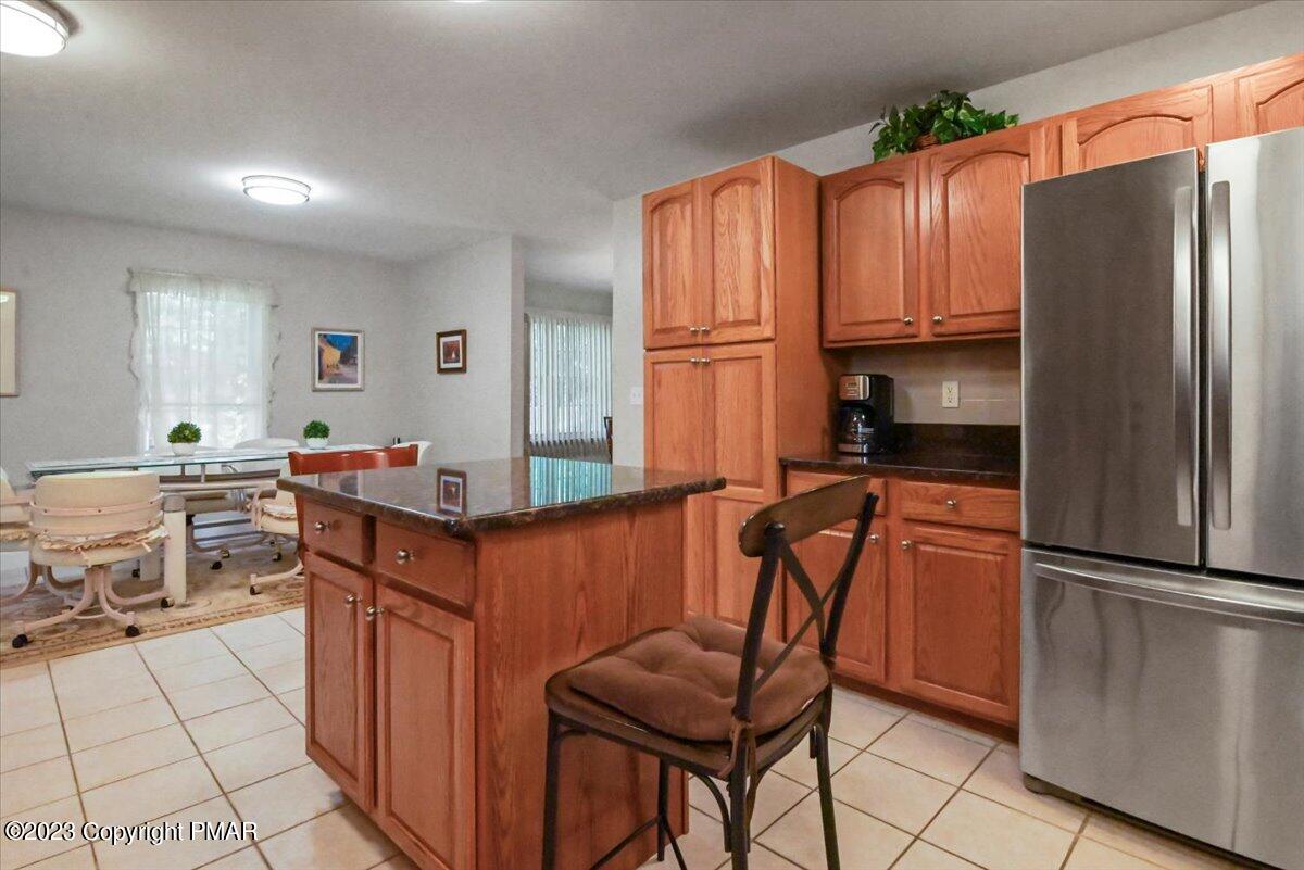105 Alford Court Bushkill, PA 18324 - Photo 21 of 64 a kitchen with stainless steel appliances granite countertop a refrigerator and a stove top oven