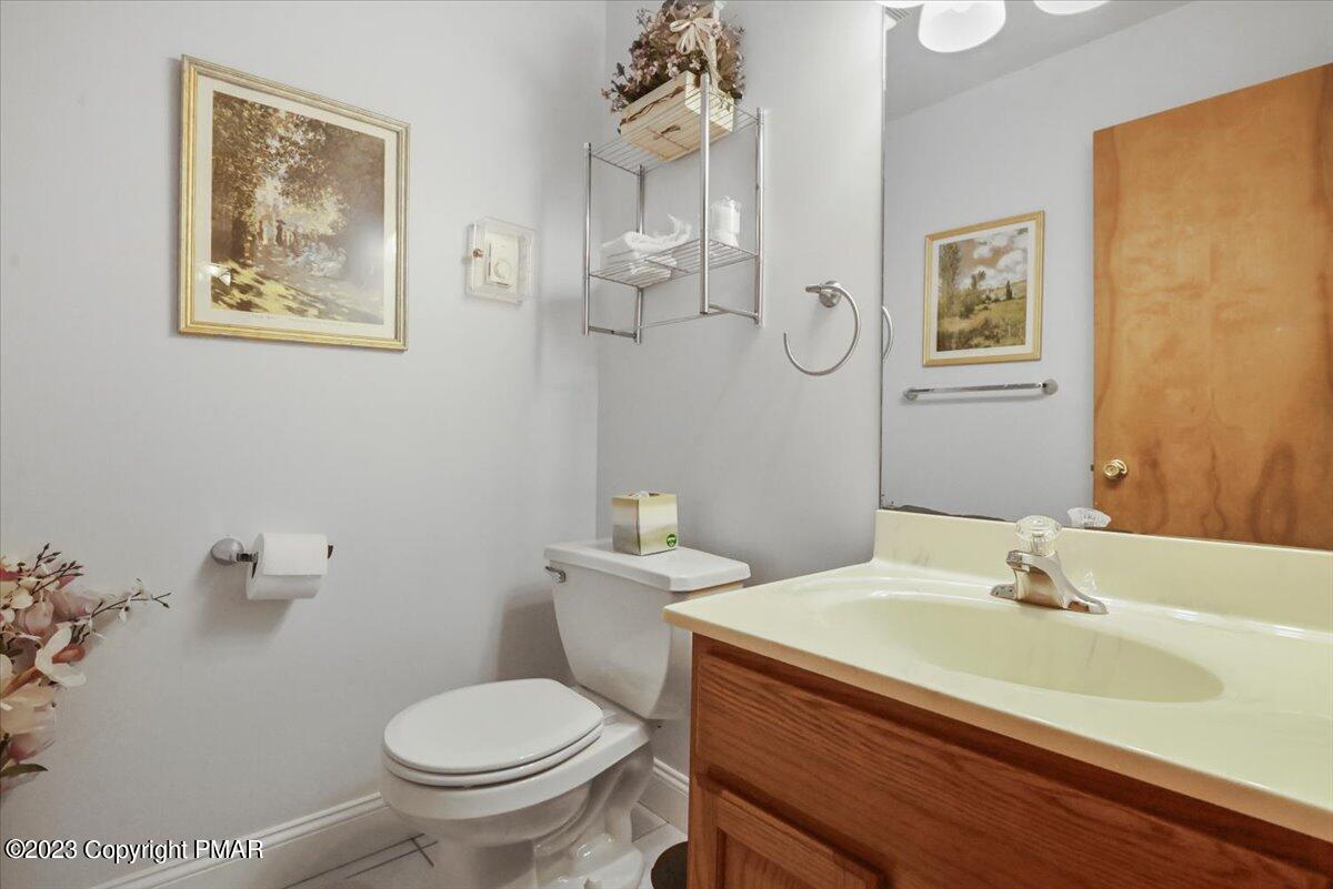 105 Alford Court Bushkill, PA 18324 - Photo 23 of 64 a bathroom with a toilet a sink and mirror