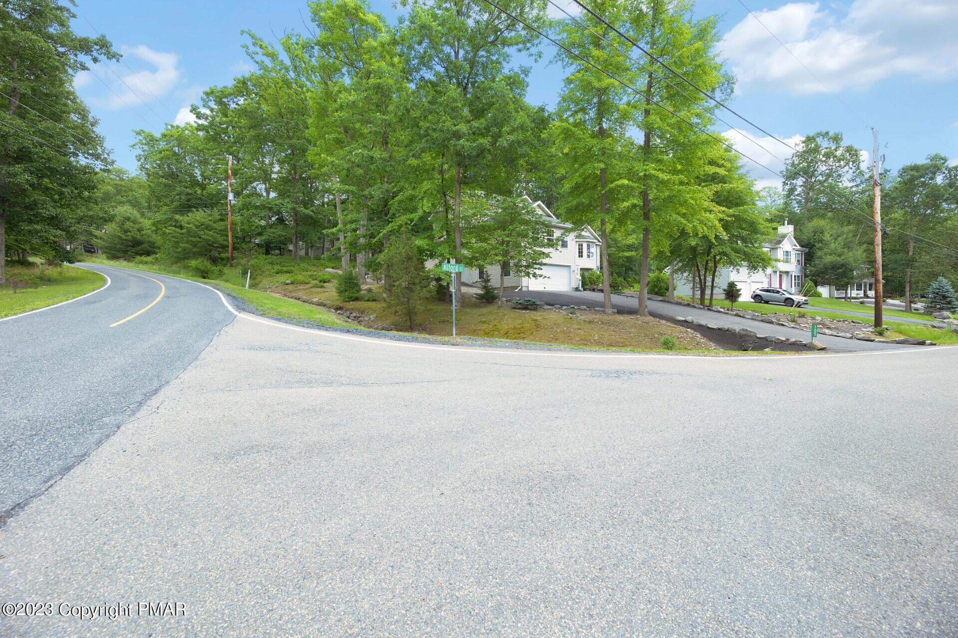105 Alford Court Bushkill, PA 18324 - Photo 3 of 64 a view of a swimming pool and a yard