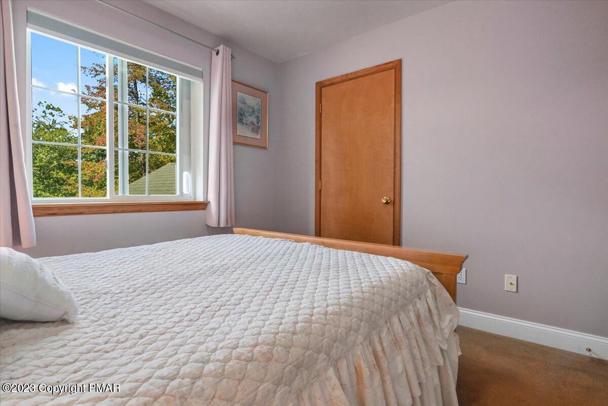 105 Alford Court Bushkill, PA 18324 - Photo 32 of 64 a bedroom with a bed and a window