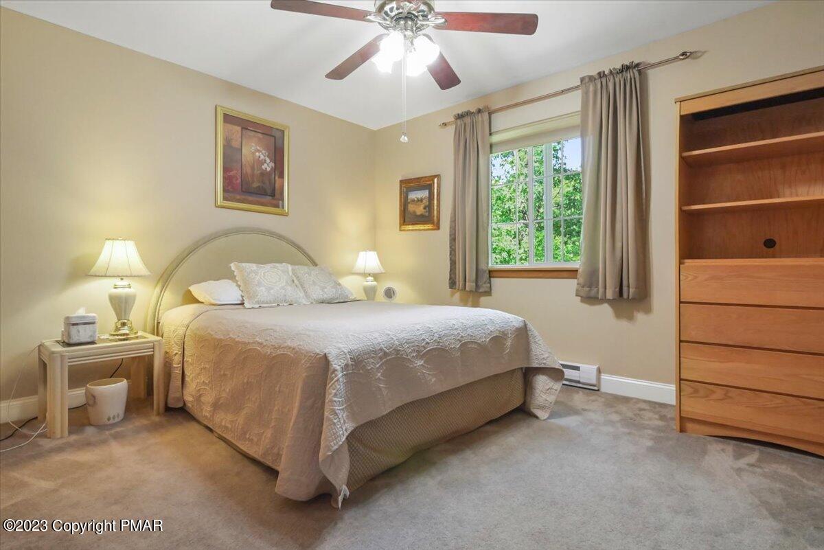 105 Alford Court Bushkill, PA 18324 - Photo 33 of 64 a bedroom with a bed and a window