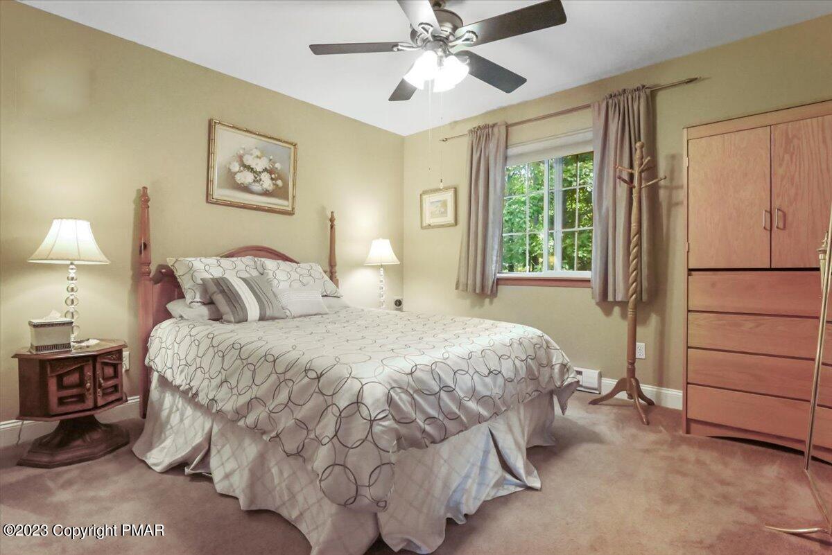 105 Alford Court Bushkill, PA 18324 - Photo 35 of 64 a bedroom with a bed and a window