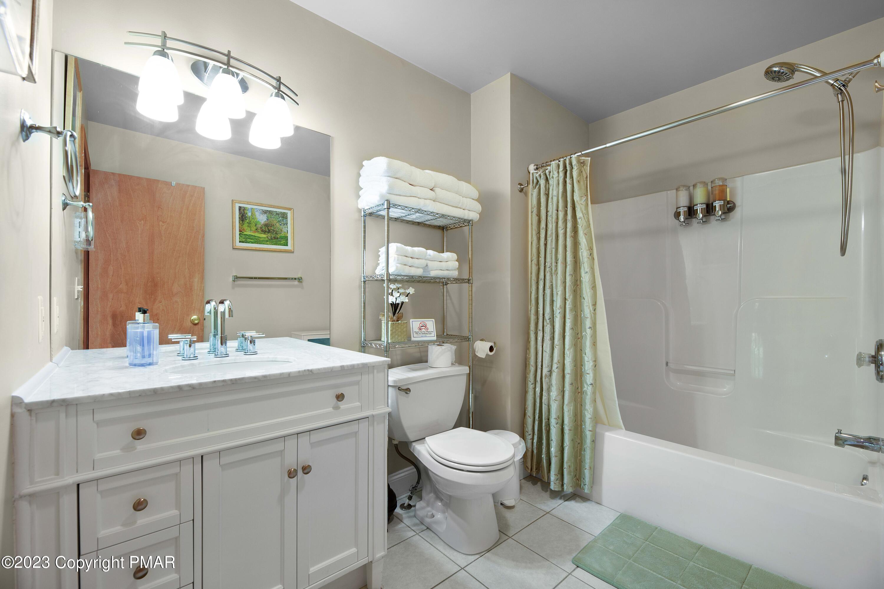 105 Alford Court Bushkill, PA 18324 - Photo 36 of 64 a bathroom with a sink a toilet and shower