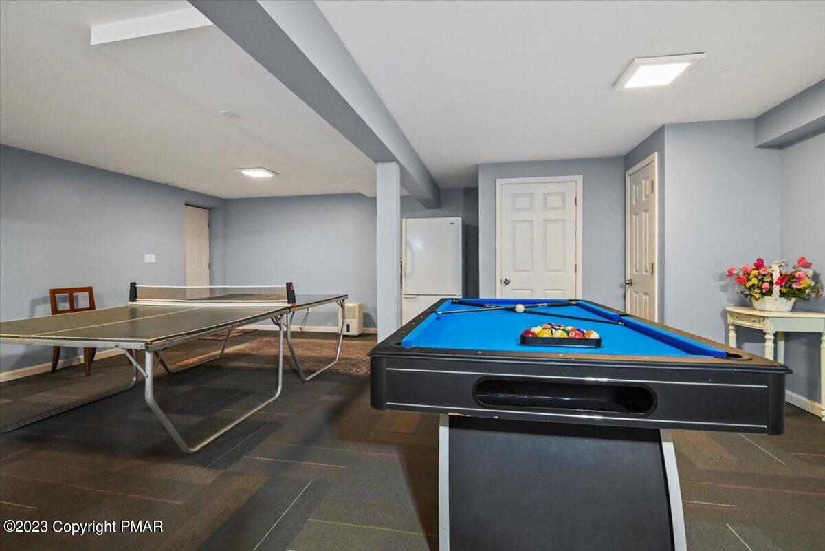 105 Alford Court Bushkill, PA 18324 - Photo 44 of 64 a room with furniture pool table gym equipment wooden floor and window