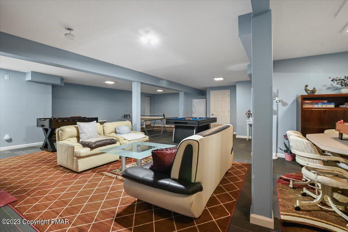 105 Alford Court Bushkill, PA 18324 - Photo 46 of 64 a living room with furniture and a flat screen tv