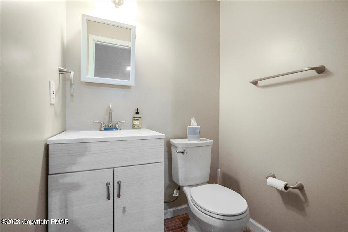 105 Alford Court Bushkill, PA 18324 - Photo 50 of 64 a bathroom with a toilet sink and mirror