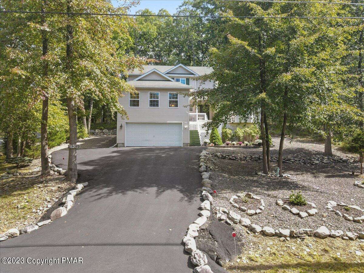 105 Alford Court Bushkill, PA 18324 - Photo 51 of 64 a front view of a house with a yard