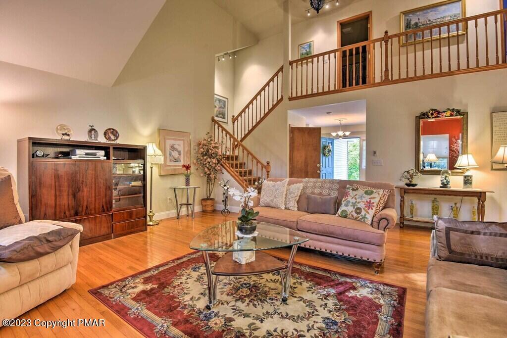 105 Alford Court Bushkill, PA 18324 - Photo 7 of 64 a living room with furniture a rug and a table
