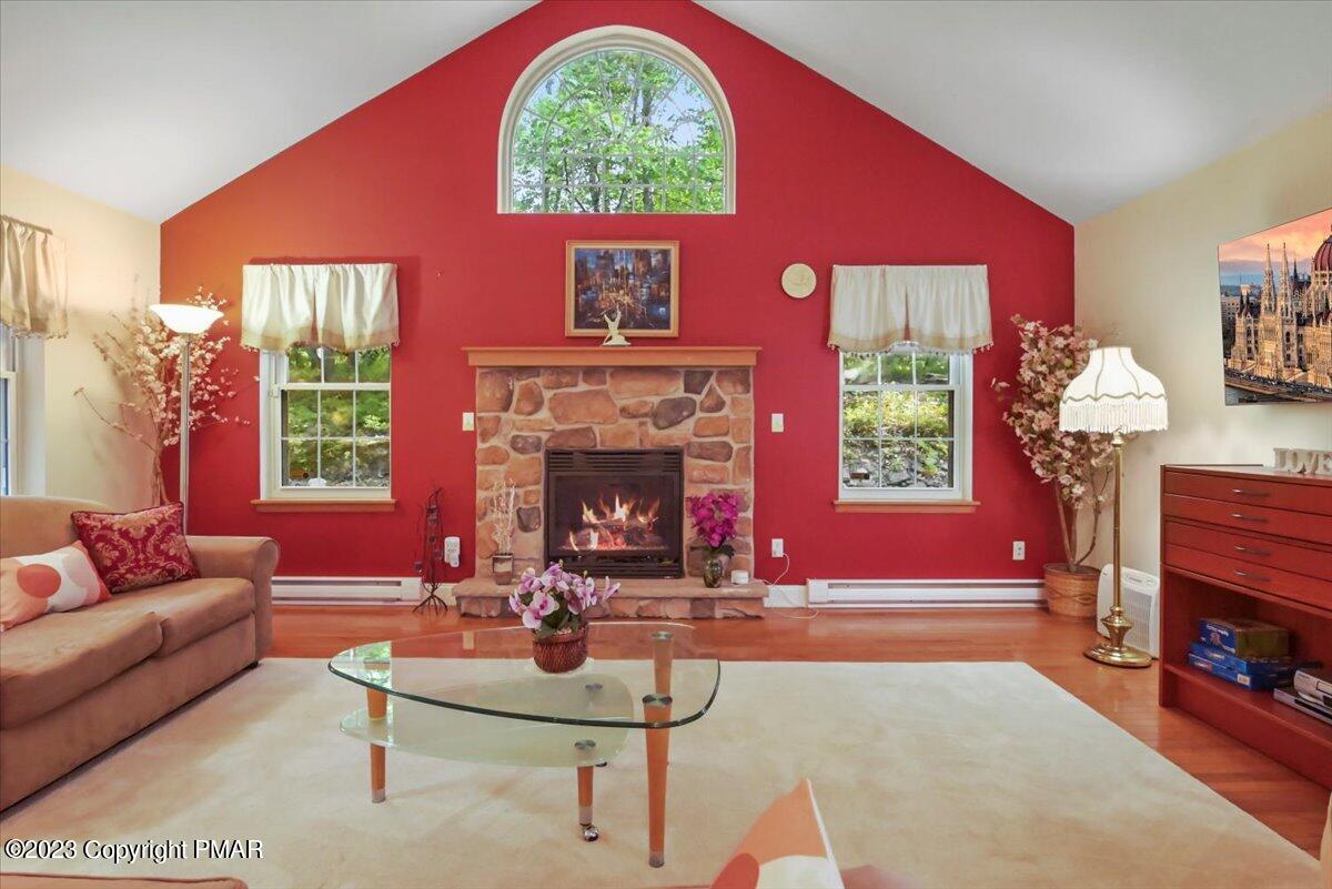 105 Alford Court Bushkill, PA 18324 - Photo 10 of 64 a living room with furniture a window and a fireplace