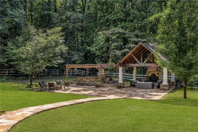 a front view of a house with garden