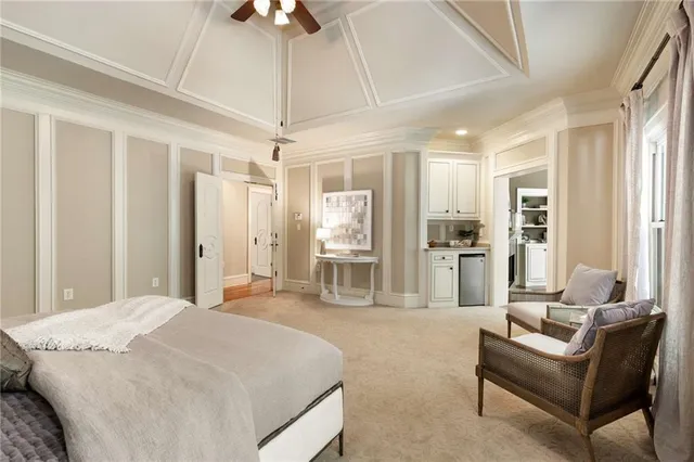 a front view of a bathroom with sink and mirror