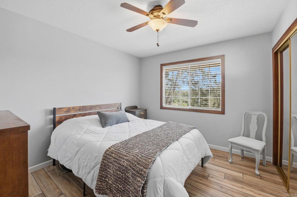 37875 Sage Road Hemet, CA 92544 - Photo 18 of 33 a bedroom with a bed and a window