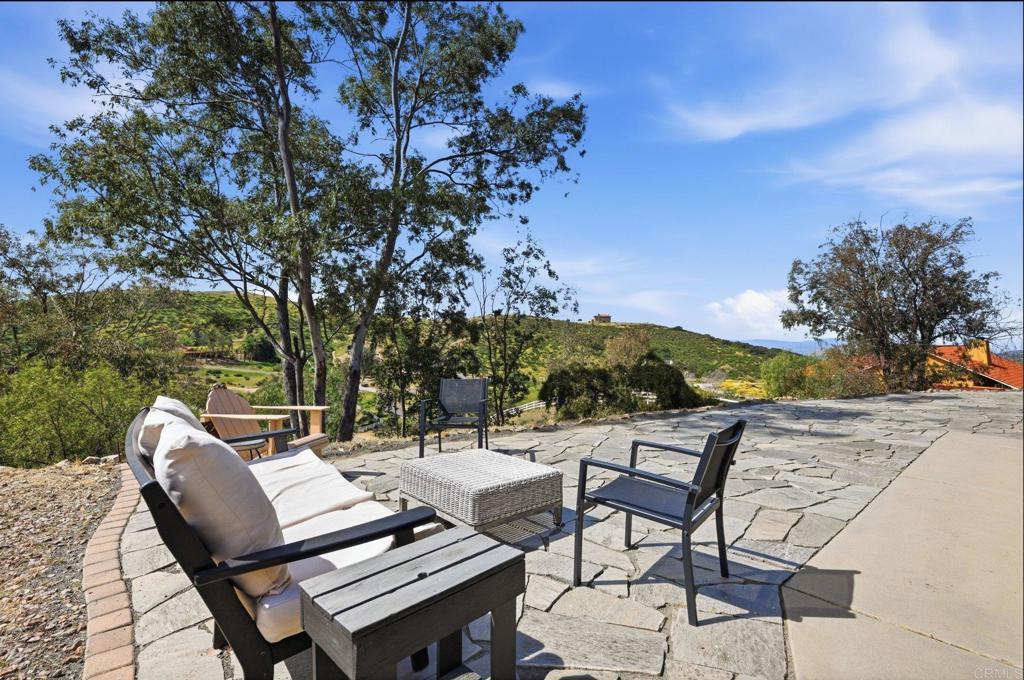 37875 Sage Road Hemet, CA 92544 - Photo 4 of 33 a view of a chairs and table in the patio