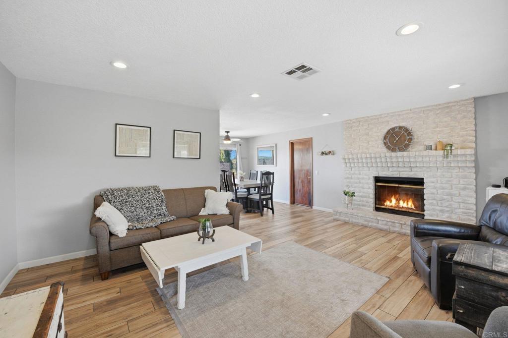 37875 Sage Road Hemet, CA 92544 - Photo 7 of 33 a living room with furniture and a fireplace