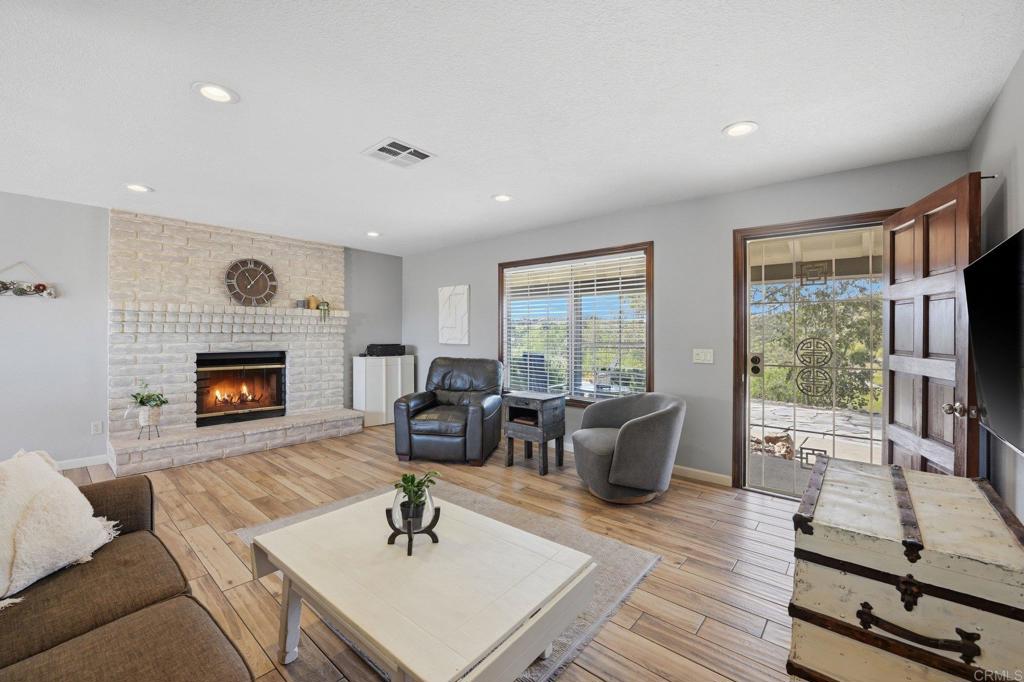 37875 Sage Road Hemet, CA 92544 - Photo 8 of 33 a living room with furniture fireplace and window