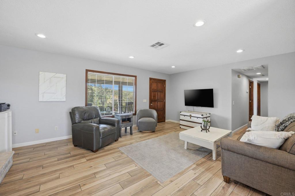 37875 Sage Road Hemet, CA 92544 - Photo 9 of 33 a living room with furniture flat screen tv and a window
