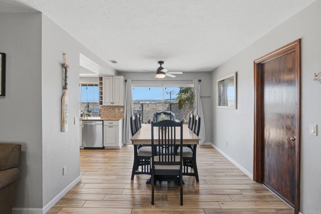 37875 Sage Road Hemet, CA 92544 - Photo 10 of 33 a view of a dining room with furniture window and wooden floor