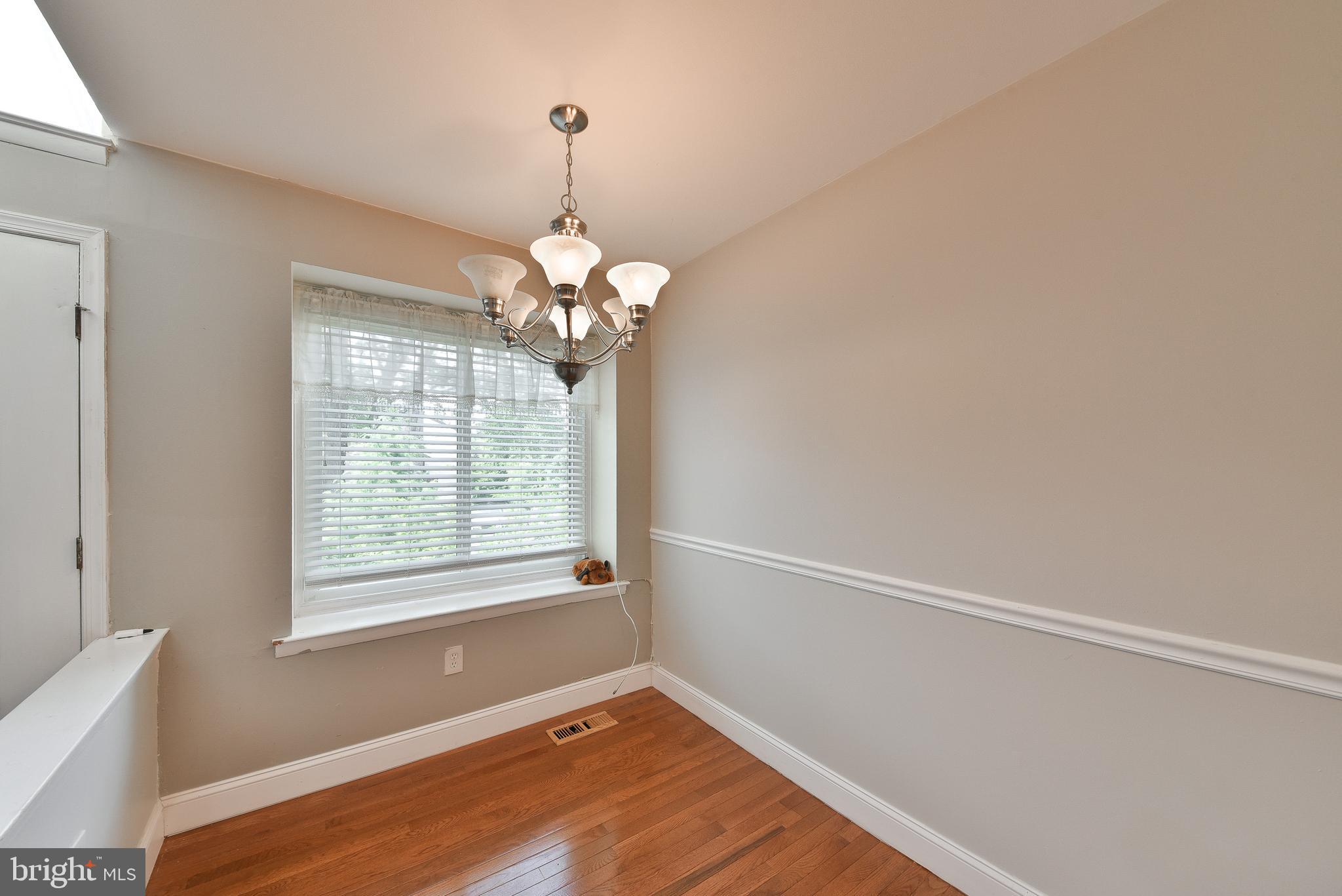 3403 Honey Run Road Ambler, PA 19002 - Photo 12 of 35 a view of an empty room with wooden floor and a window
