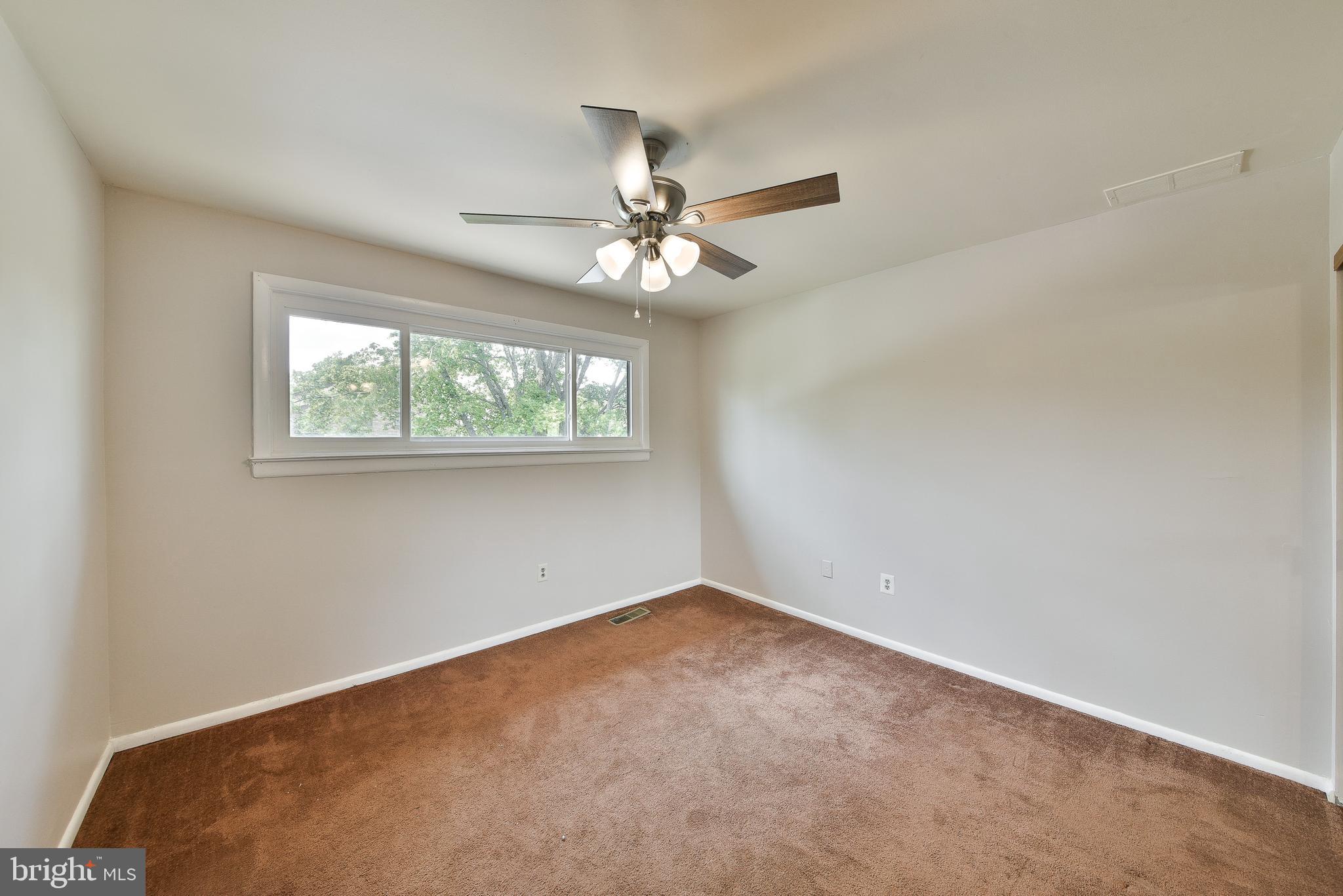 3403 Honey Run Road Ambler, PA 19002 - Photo 15 of 35 an empty room with a window and a fan