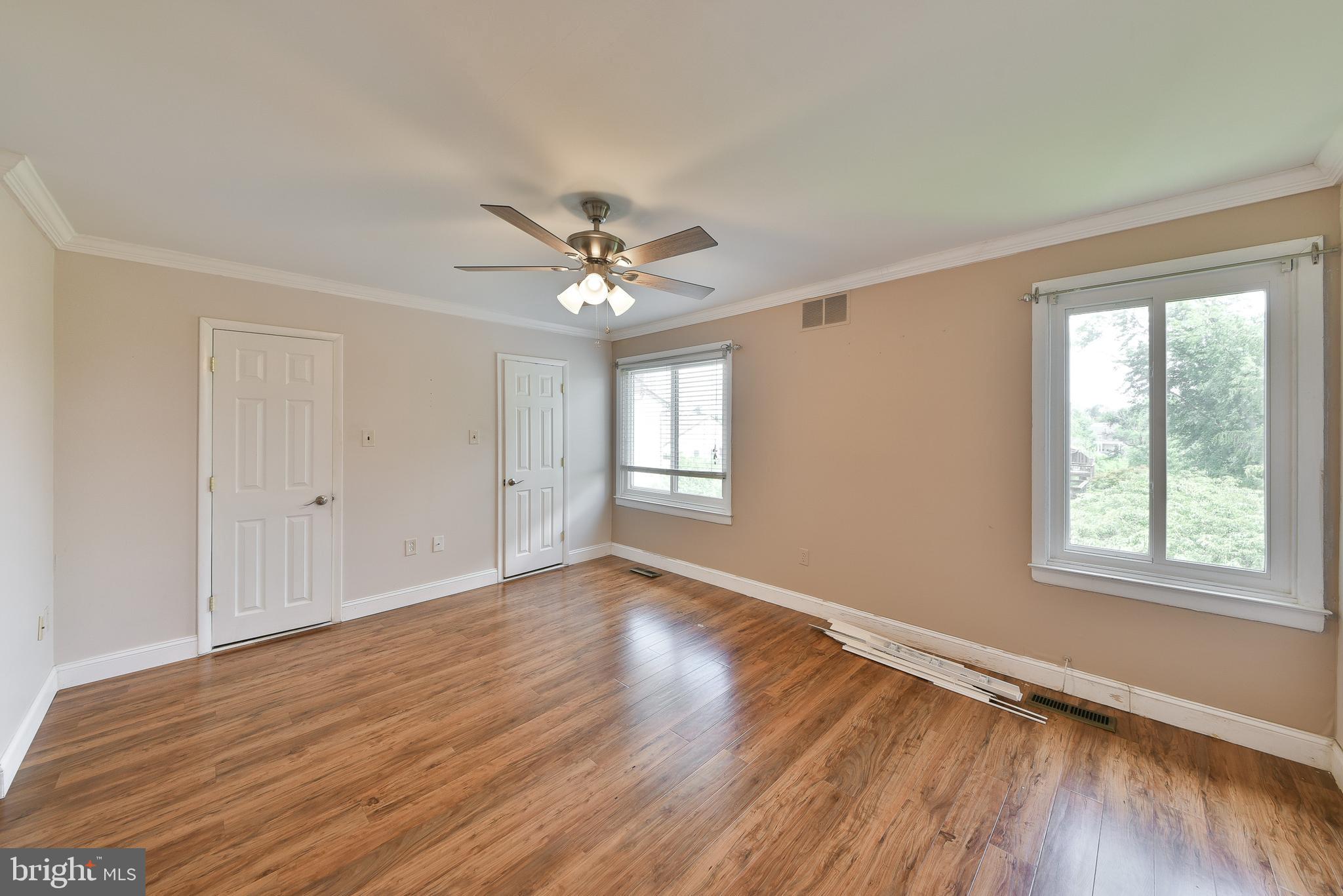 3403 Honey Run Road Ambler, PA 19002 - Photo 21 of 35 a view of an empty room with a window and wooden floor