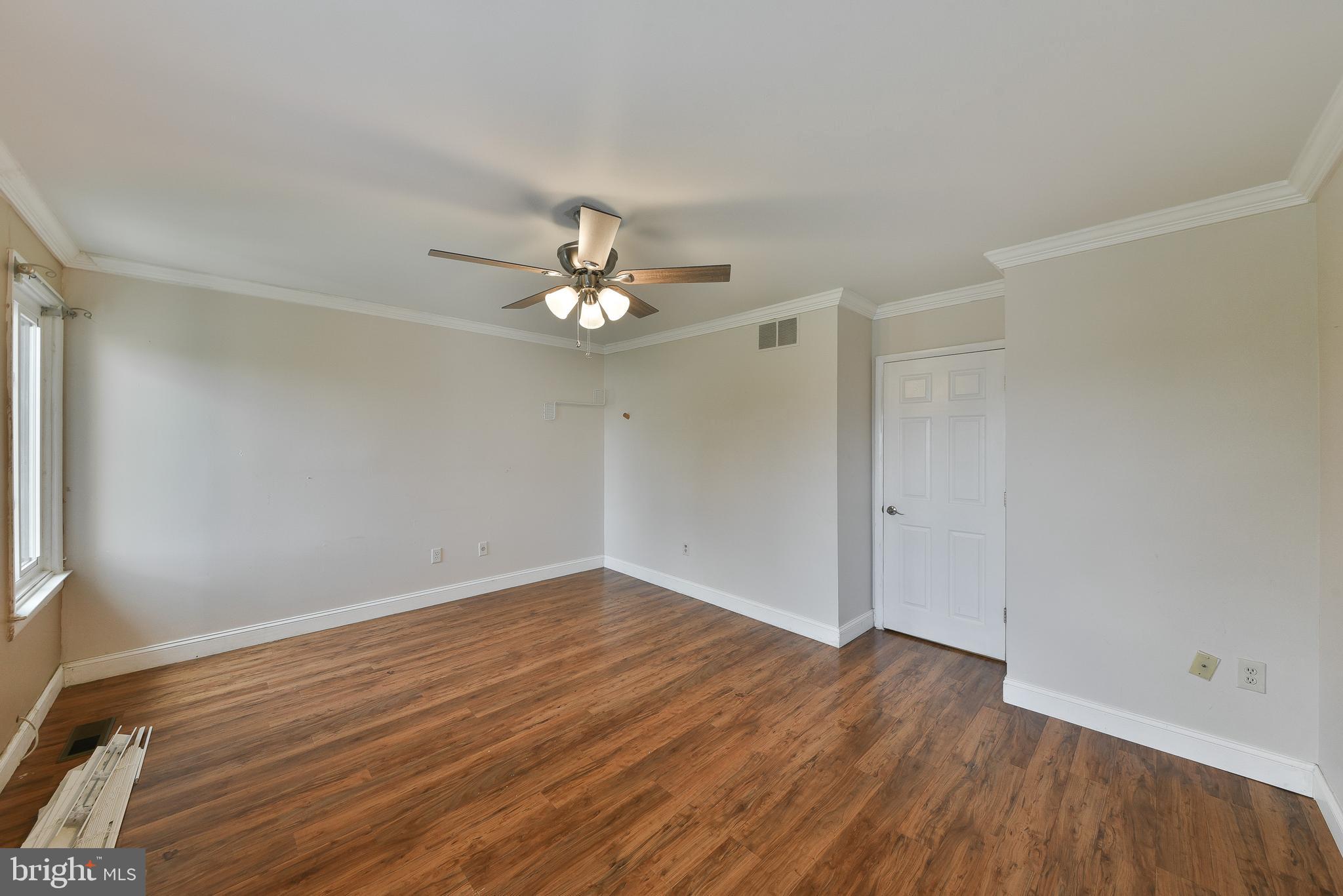 3403 Honey Run Road Ambler, PA 19002 - Photo 22 of 35 a view of an empty room with wooden floor and a window