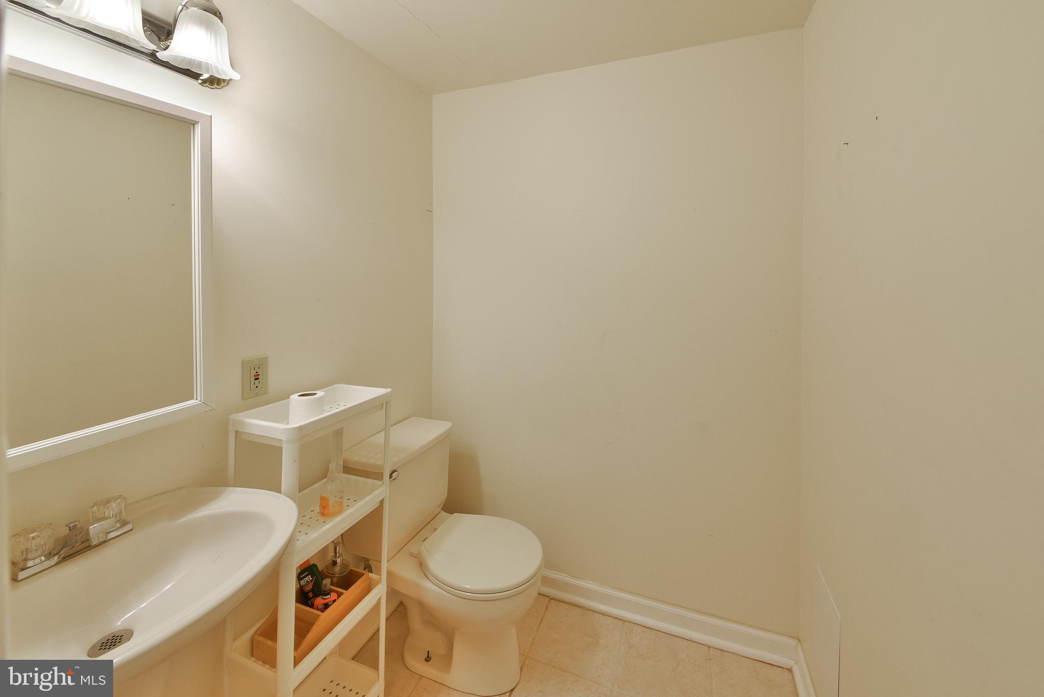 3403 Honey Run Road Ambler, PA 19002 - Photo 30 of 35 a white toilet sitting next to a bathroom sink