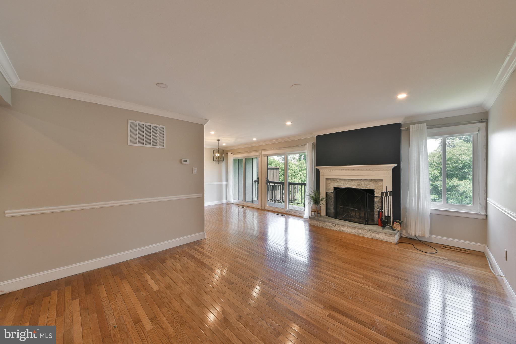 3403 Honey Run Road Ambler, PA 19002 - Photo 5 of 35 a view of empty room with wooden floor and fireplace