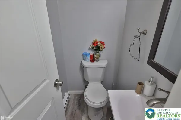 a bath room with a toilet and a shower