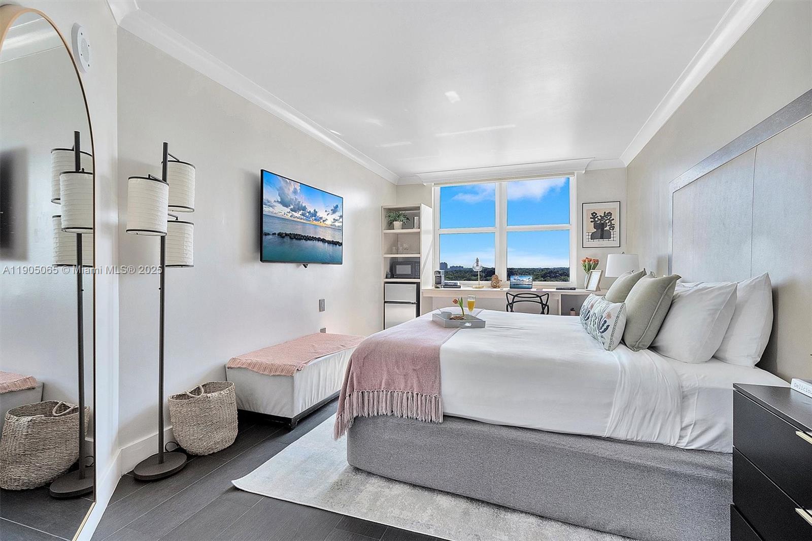 2889 McFarlane Road, Unit 902 Miami, FL 33133 - Photo 12 of 62 a bedroom with a bed and a large window