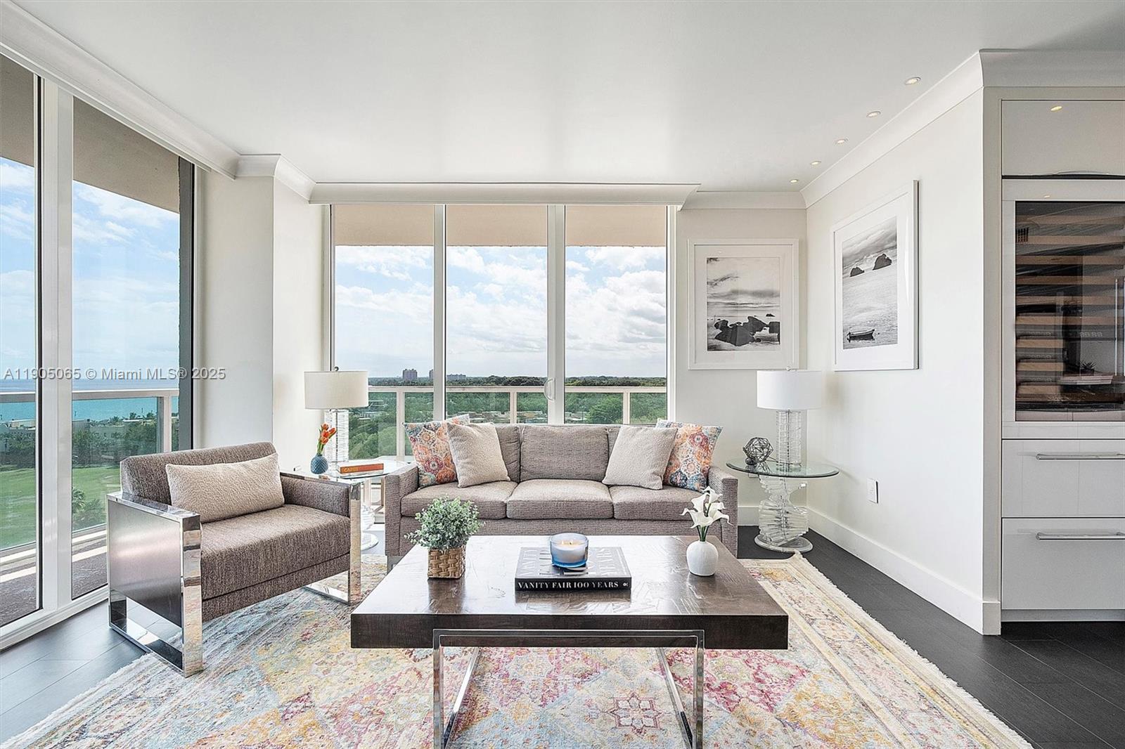 2889 McFarlane Road, Unit 902 Miami, FL 33133 - Photo 13 of 62 a living room with furniture and a large window
