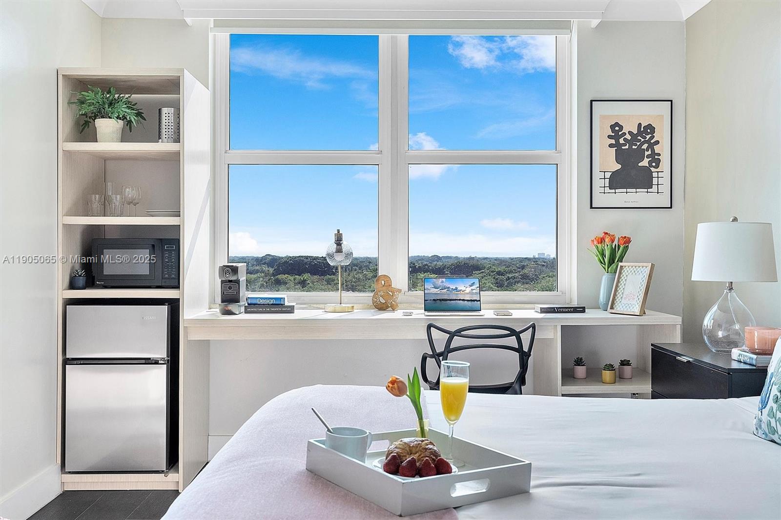 2889 McFarlane Road, Unit 902 Miami, FL 33133 - Photo 14 of 62 a living room with furniture and a window